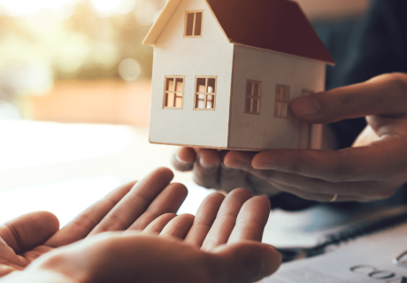 Man handing over a house to the new owner