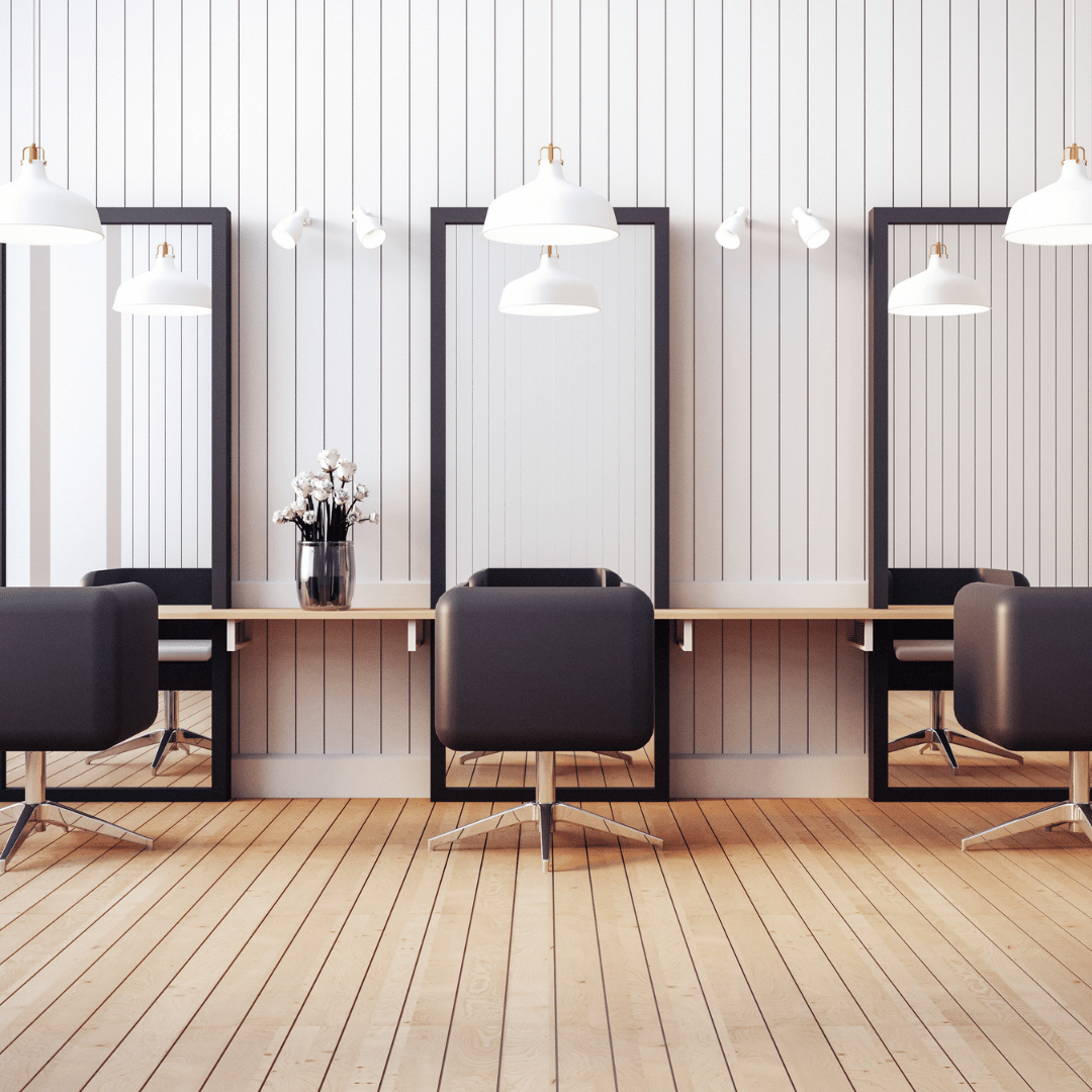 3 empty chairs at a salon. We talk about the common hair salon plugins for your WordPress website.