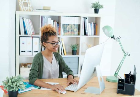 Is Your Website Costing You Sales? 5 Signs It's Time for a Redesign 42 Woman Smiling Computer